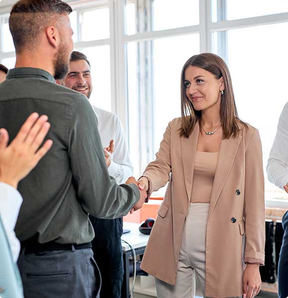 People shaking hands in an office